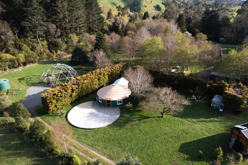 Aerial view of the yurt and domes among autumn trees